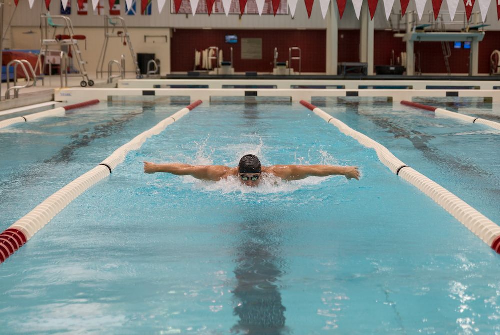 student swimming at the hper pool